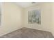 Bedroom features a plush carpet, neutral paint, and large window that invites natural light at 4229 E Crest Ct, Gilbert, AZ 85298