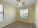 Charming bedroom with large window and ceiling fan at 4229 E Crest Ct, Gilbert, AZ 85298