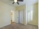 Bright bedroom with ceiling fan and access to laundry room at 4229 E Crest Ct, Gilbert, AZ 85298