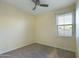 Bright bedroom with ceiling fan and window with blinds at 4229 E Crest Ct, Gilbert, AZ 85298