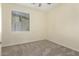 Bedroom with neutral walls, carpet flooring, and a window for natural light at 4229 E Crest Ct, Gilbert, AZ 85298