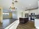 Open concept kitchen with island and adjacent living area at 4229 E Crest Ct, Gilbert, AZ 85298