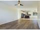 Spacious living room with wood-look flooring and ceiling fan at 4229 E Crest Ct, Gilbert, AZ 85298