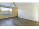 Bright living room with wood-look floors and view to kitchen at 4229 E Crest Ct, Gilbert, AZ 85298