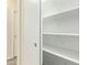 Pantry with adjustable shelving, electrical outlets, and easy access to other rooms at 4229 E Crest Ct, Gilbert, AZ 85298