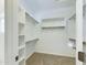 Spacious walk-in closet with ample shelving and hanging space at 4229 E Crest Ct, Gilbert, AZ 85298