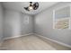 Simple bedroom with neutral walls and carpet at 4257 E John St, Gilbert, AZ 85295