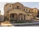 Two-story house with stone accents, landscaping, and a two-car garage at 4257 E John St, Gilbert, AZ 85295