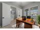 Home office with wood desk and view of entryway at 4257 E John St, Gilbert, AZ 85295