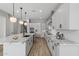 Modern kitchen with white cabinets and granite countertops at 4257 E John St, Gilbert, AZ 85295