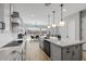 Modern kitchen with white cabinets and granite countertops at 4257 E John St, Gilbert, AZ 85295