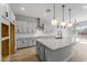 Modern kitchen with white cabinets and granite countertops at 4257 E John St, Gilbert, AZ 85295