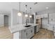 Modern kitchen with white cabinets and granite countertops at 4257 E John St, Gilbert, AZ 85295