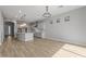 Modern kitchen with gray cabinets, island, and a chandelier at 4257 E John St, Gilbert, AZ 85295