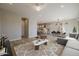 Living room with gray sectional sofa and patterned rug at 4257 E John St, Gilbert, AZ 85295