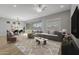 Living room with gray sectional sofa and modern coffee table at 4257 E John St, Gilbert, AZ 85295