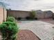 Small backyard with paver patio and artificial turf at 42659 W Sunland Dr, Maricopa, AZ 85138