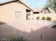 Large backyard with gravel and a patio area at 42659 W Sunland Dr, Maricopa, AZ 85138