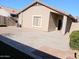 Private backyard with paved patio and gravel landscaping at 42659 W Sunland Dr, Maricopa, AZ 85138