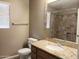 Bathroom with granite vanity and tiled shower/tub combo at 42659 W Sunland Dr, Maricopa, AZ 85138