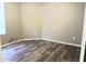 Spacious bedroom with laminate wood flooring at 42659 W Sunland Dr, Maricopa, AZ 85138