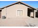 Tan house exterior with covered patio and AC unit at 42659 W Sunland Dr, Maricopa, AZ 85138