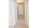 Bright hallway with tile flooring and multiple doors at 42659 W Sunland Dr, Maricopa, AZ 85138