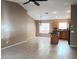 Open kitchen with island, wood cabinets, and tiled floors at 42659 W Sunland Dr, Maricopa, AZ 85138