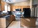 Modern kitchen with stainless steel appliances and granite countertops at 42659 W Sunland Dr, Maricopa, AZ 85138