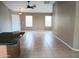 Spacious living room with tile floors and neutral walls at 42659 W Sunland Dr, Maricopa, AZ 85138