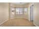 Bright bedroom with neutral carpeting and bay window at 42788 W Martie Lynn Rd, Maricopa, AZ 85138