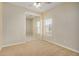 Bright bedroom with mirrored closet doors and neutral carpeting at 42788 W Martie Lynn Rd, Maricopa, AZ 85138