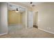 Bedroom with mirrored closet doors and ceiling fan at 42788 W Martie Lynn Rd, Maricopa, AZ 85138