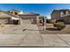 Two-story house with tan exterior, two-car garage, and small front yard at 42788 W Martie Lynn Rd, Maricopa, AZ 85138