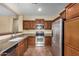 Kitchen with stainless steel appliances and wood cabinets at 42788 W Martie Lynn Rd, Maricopa, AZ 85138