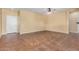 Living room with tile floors and ceiling fan at 42788 W Martie Lynn Rd, Maricopa, AZ 85138