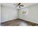 Spacious bedroom with wood-look floors and ceiling fan at 4346 E Earll Dr, Phoenix, AZ 85018