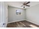 Well-lit bedroom featuring wood-look floors and ceiling fan at 4346 E Earll Dr, Phoenix, AZ 85018