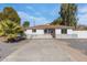 Ranch-style home with a paved driveway and updated fence at 4346 E Earll Dr, Phoenix, AZ 85018