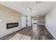 Open living area showcasing a modern electric fireplace and wood-look floors at 4346 E Earll Dr, Phoenix, AZ 85018