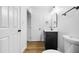 Modern bathroom with dark vanity, white toilet and grey tile at 4607 E Park St, Phoenix, AZ 85042