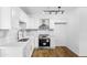 Modern white kitchen with stainless steel appliances and white shaker cabinets at 4607 E Park St, Phoenix, AZ 85042