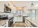 Clean and spacious kitchen with white cabinets and granite countertops at 4737 N 9Th St, Phoenix, AZ 85014