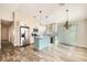 Modern kitchen featuring stainless steel appliances and a light teal island at 4737 N 9Th St, Phoenix, AZ 85014