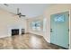 Bright living room with wood-look floors, fireplace, and ceiling fan at 4737 N 9Th St, Phoenix, AZ 85014