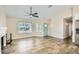 Living room featuring wood-look floors, fireplace, and ceiling fan at 4737 N 9Th St, Phoenix, AZ 85014