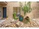 Condo exterior with a landscaped courtyard, featuring drought-tolerant plants and rock landscaping at 5136 N 31St Pl # 614, Phoenix, AZ 85016