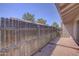 Private backyard with wooden fence and brick patio at 629 N Mesa Dr # 29, Mesa, AZ 85201