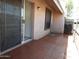 Private patio with brick flooring and sliding glass door access at 629 N Mesa Dr # 29, Mesa, AZ 85201