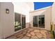 Inviting courtyard with flagstone flooring and access to interior at 6309 N 14Th St, Phoenix, AZ 85014